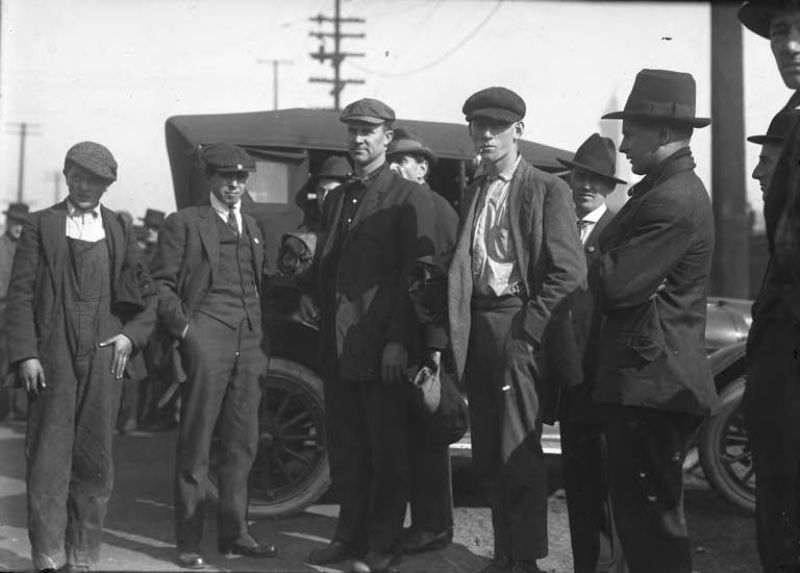 1920s Style Men Seattle Workwear 1920s men photographed in Seattle, Washington, wearing workwear such as overalls and work shirts with flat caps.
