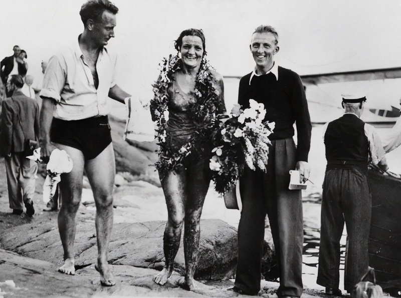 1930s Fashion Men Sigge Bergman Staffan Tjerneld Journalists Sigfrid Bergman and Staffan Tjerneld celebrate with swimmer Sally Bauer after she crossed the Sea of Åland in 1938.