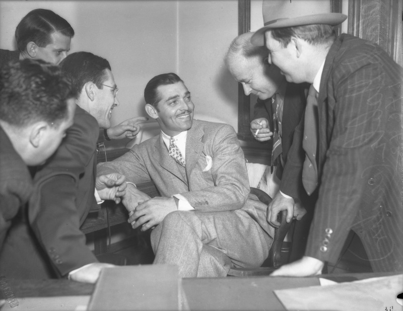 1930s Mens Fashion Clark Gable Men 1937 Clark Gable converses with a group of men circa 1937.