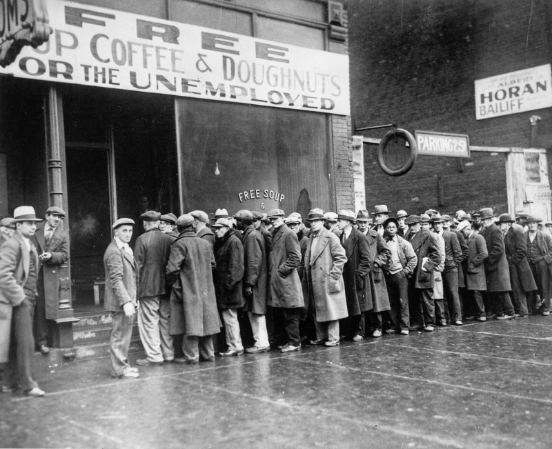1930s Mens Fashion Depression Soup Kitchen 1931 Men queue outside a 1931 depression soup kitchen opened by Al Capone in Chicago.