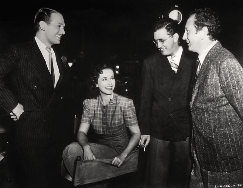 1930s Mens Fashion The Young in Heart Douglas Fairbanks Jr., Paulette Goddard, David O. Selznick, and Richard Wallace on the 1938 set of The Young in Heart.