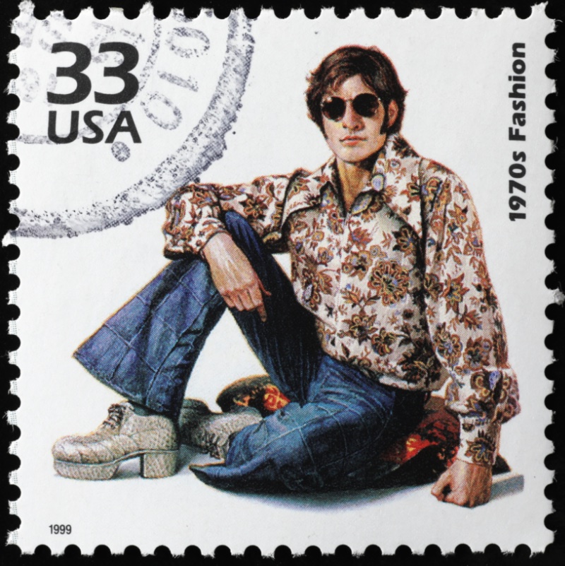 1970s Fashion Stamp 1970s fashion stamp featuring man in paisley print shirt with flared jeans and platform shoes.