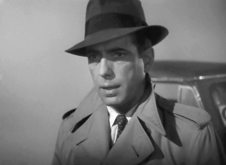 40s Fashion Men Humphrey Bogart Casablanca Fedora Trench 1940s Men's Fashion: Portraying Rick Blaine in Casablanca (1942), actor Humphrey Bogart made an impression in a trench and fedora as one of the most memorable visuals of the era.