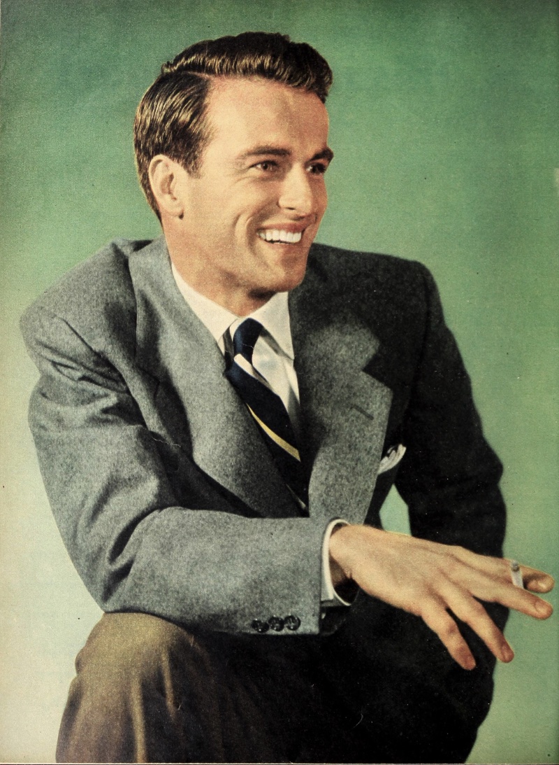 50s Fashion Men Montgomery Clift Portrait Color Smiling Montgomery Clift is all smiles for a 1950s studio portrait.