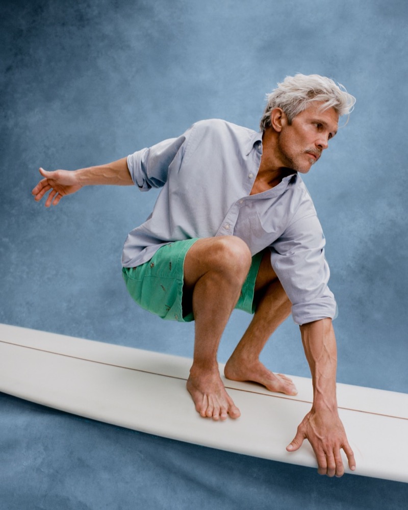 BEAMS PLUS x JCrew Collection 2024 003 Thaddeus O'Neil wears a button-down with BEAMS PLUS x J.Crew 8.5'' pleated chino shorts.