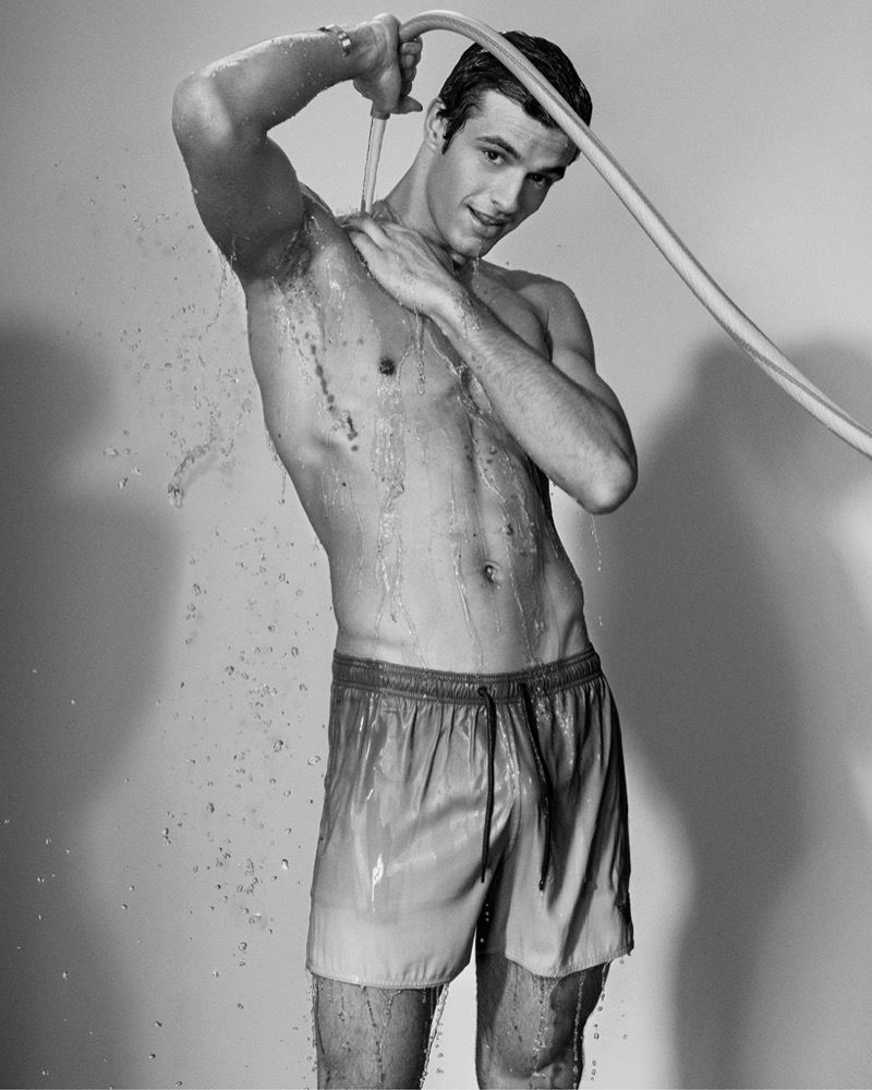 Emporio Armani Beachwear Spring Summer 2024 003 Francesco Ruggiero wears swim shorts from Emporio Armani's summer 2024 beachwear collection.