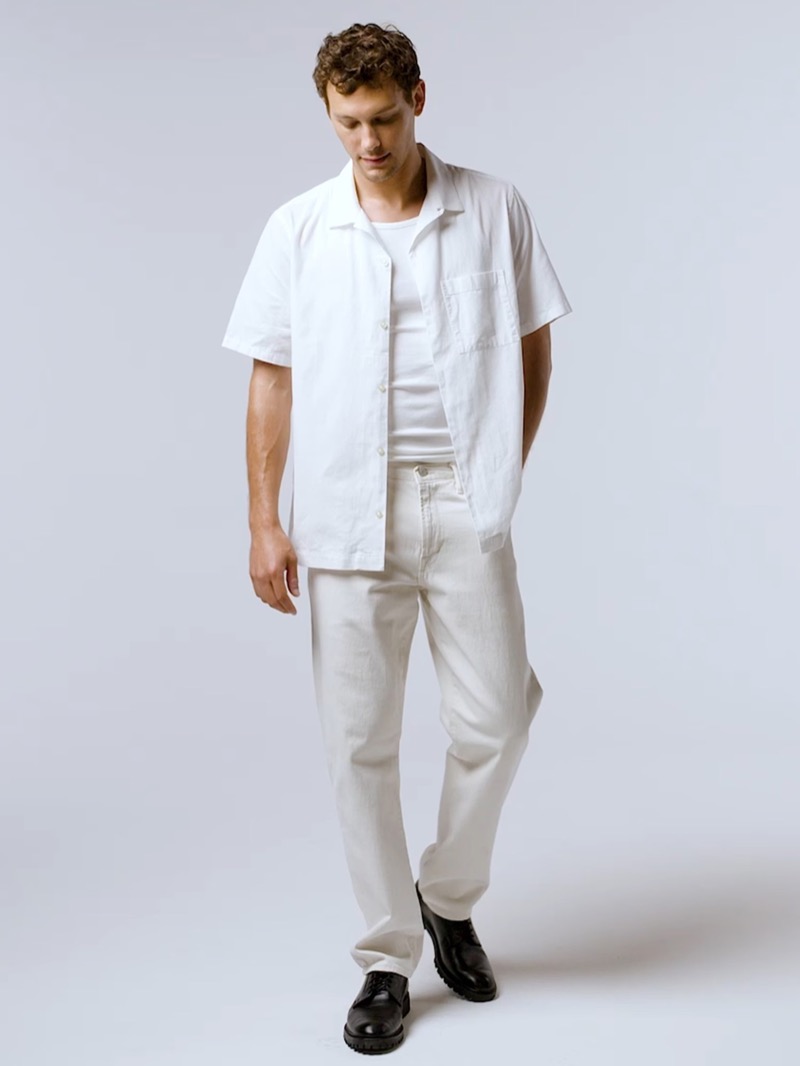 Gap Summer 2024 004 Cooper Koch wears a short-sleeve linen shirt, ribbed tank, and straight jeans.