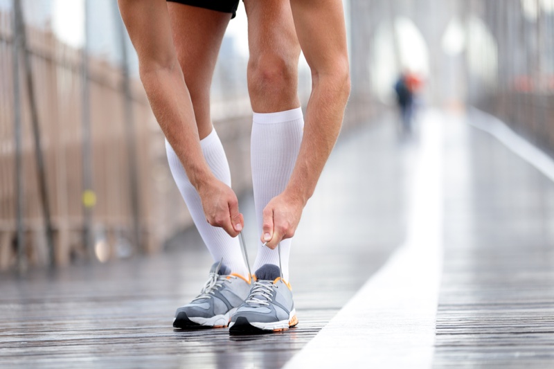 Man Tying Sneakers Calf Length White Socks Man Tying Sneakers Calf Length White Socks