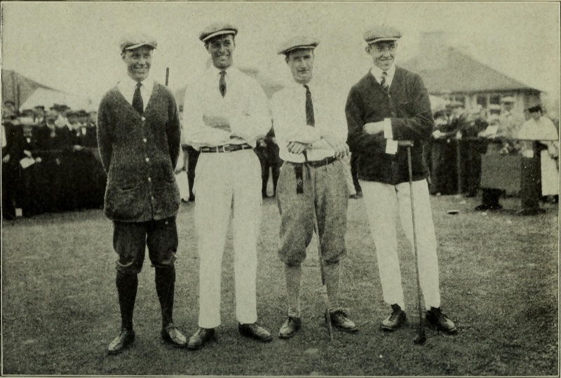 Men 1920s Fashion Golf White Pants Flat Caps Cardigans 1920s men pose for a photo at a game of golf. The men wear the current golf attire trends of the time with white pants, cardigan sweaters, knickerbockers, and flat caps.