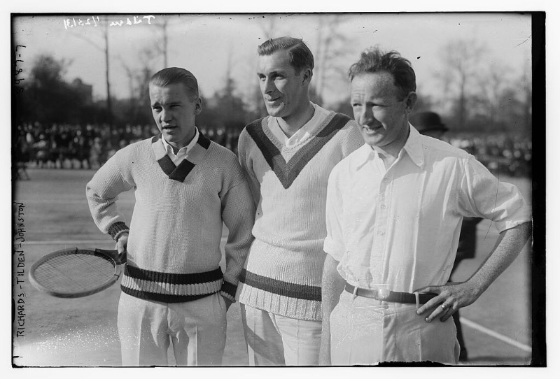 Mens 1920s Fashion Tennis Tennis players Vincent Richards, Bill Tilden, and Bill Johnston pose for photos at a 1923 tennis match in v-neck sweaters and casual white shirts.