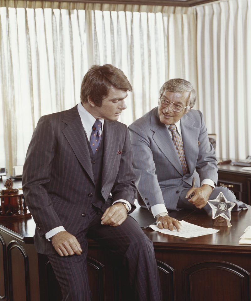 Two Men in Suits Wide Lapels 70s Style Fashion A significant differentiator for suits in the seventies were a wide lapel.