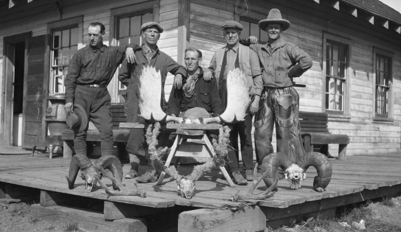 Winslow Noble 1920s Mens Fashion Hunting Country Jacket Winslow Noble and friends pose with hunting trophies in 1920s styles such as the country jacket.